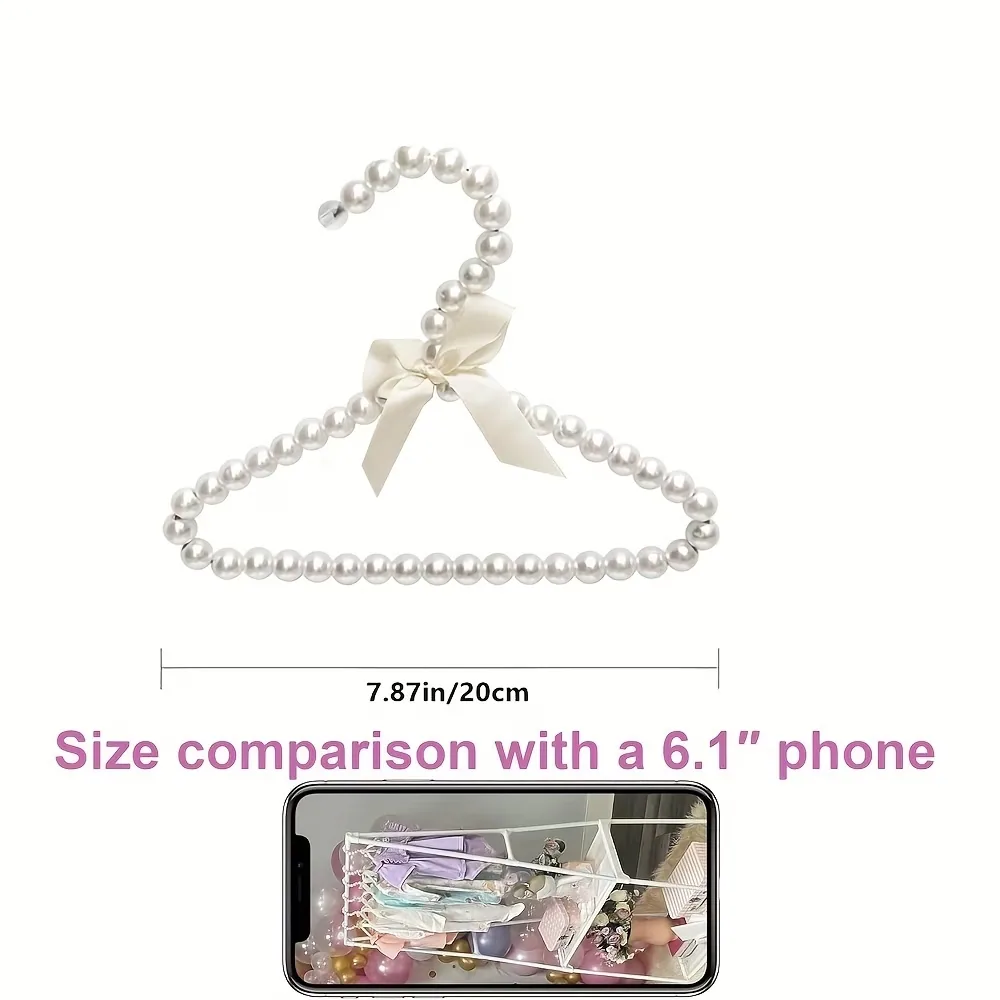Kids pearl beaded hanger size comparison showing 20cm width beside a 6.1 inch phone